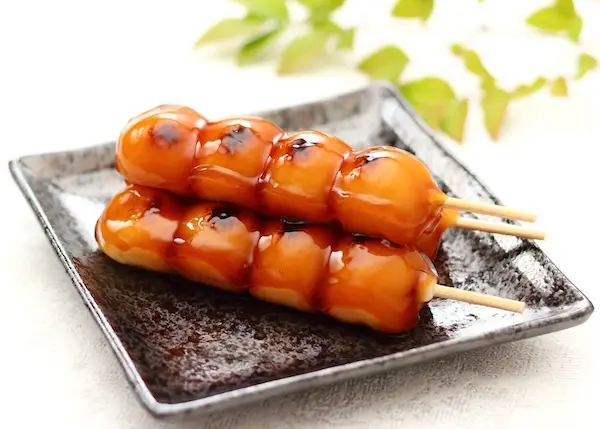 Mitarashi dango, a sweet soy-glazed Japanese rice dumpling, enjoyed during Tsukimi: Japanese Moon Viewing in autumn.