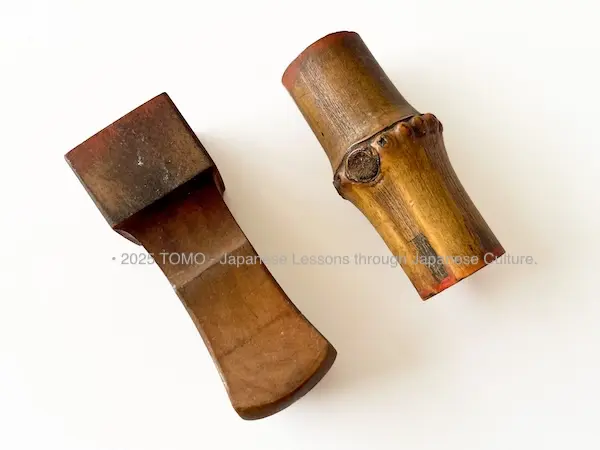 Wooden and bamboo Japanese seals (hanko) showing the natural textures and warm tones of the materials.