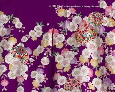 Elegant purple kimono with cherry blossom and temari designs.