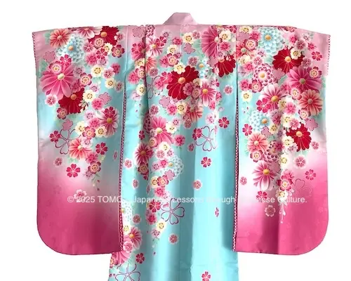 Light blue and pink kimono for a seven-year-old girl, worn for the Shichi-Go-San celebration.