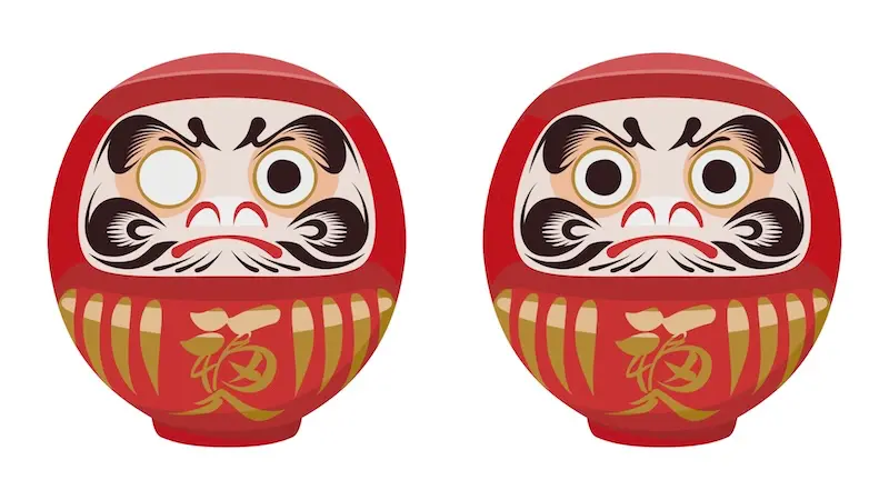 Daruma dolls before and after a wish comes true